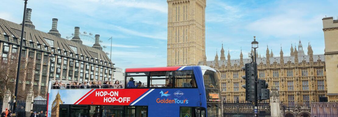 Red and blue bus in front of Big Ben